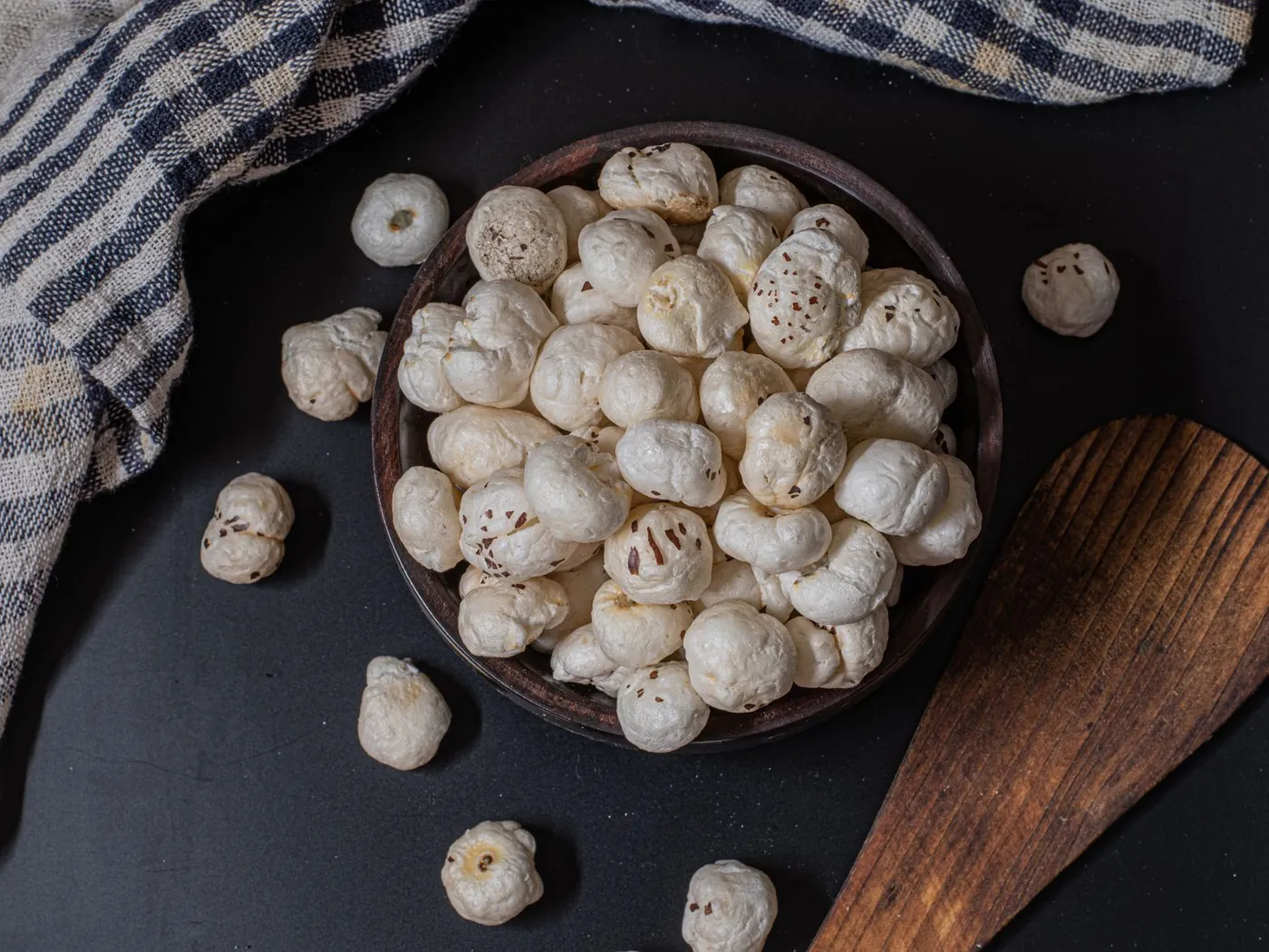 Popped makhana (fox nuts) in a wooden bowl